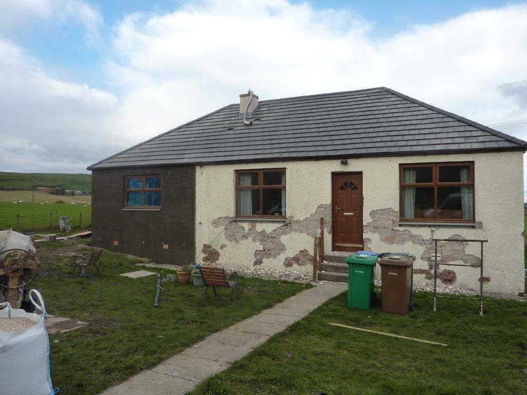 Re-slated cottage roof with new leadwork around the chimney